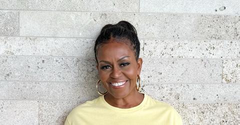 Michelle Obama wears a yellow shirt.