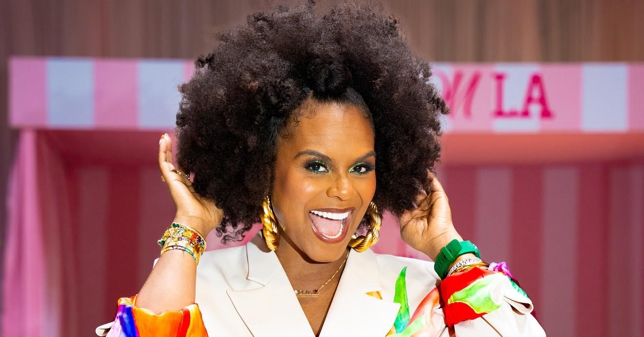 Tabitha Brown wears a colorful jumpsuit.