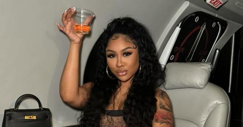 Ari Fletcher on a private plane drinking liquor.