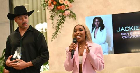 Sir John presents Jackie Aina with an award during the Black Beauty Roster Excellence Awards