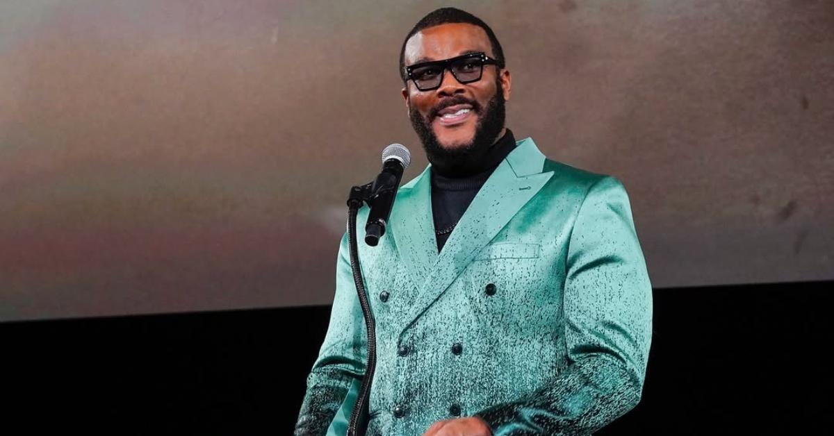 Tyler Perry is wearing a turquoise suit.