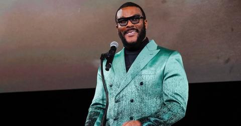 Tyler Perry is wearing a turquoise suit.