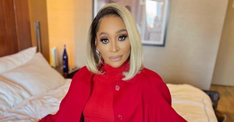 Karen Huger wears a red turtleneck.