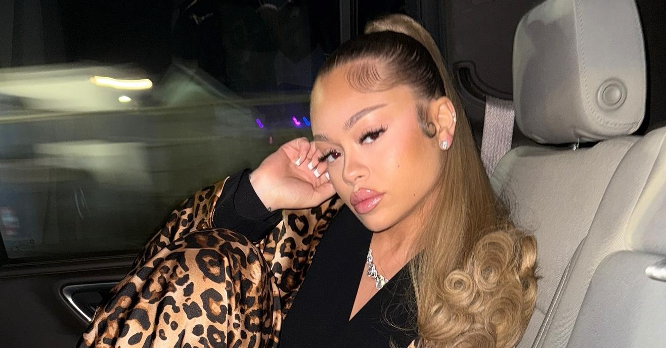 Latto wears a cheetah print robe