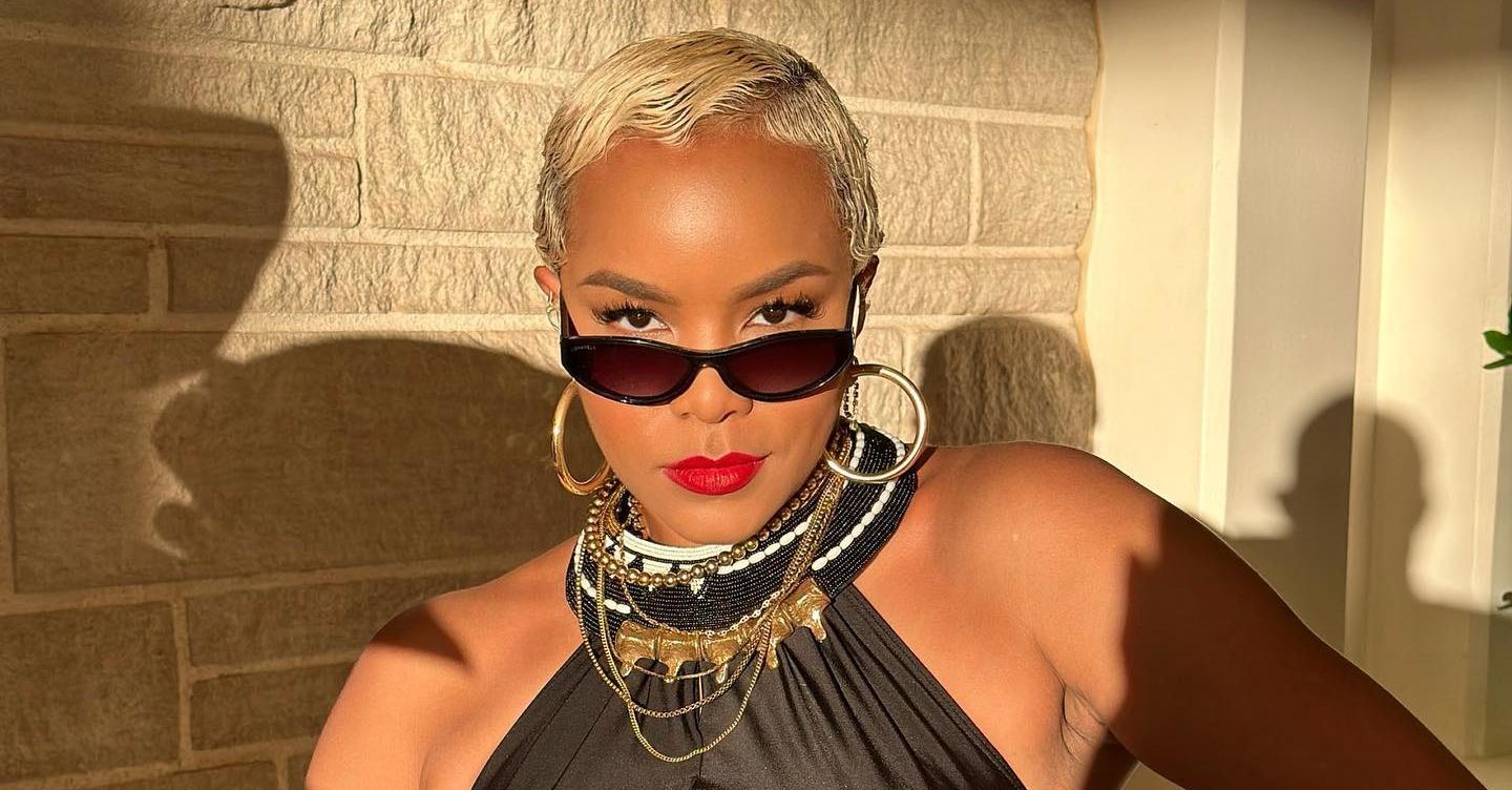 Letoya Luckett wears sunglasses and red lipstick