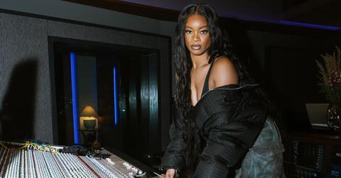Ari Lennox poses at a recording studio.
