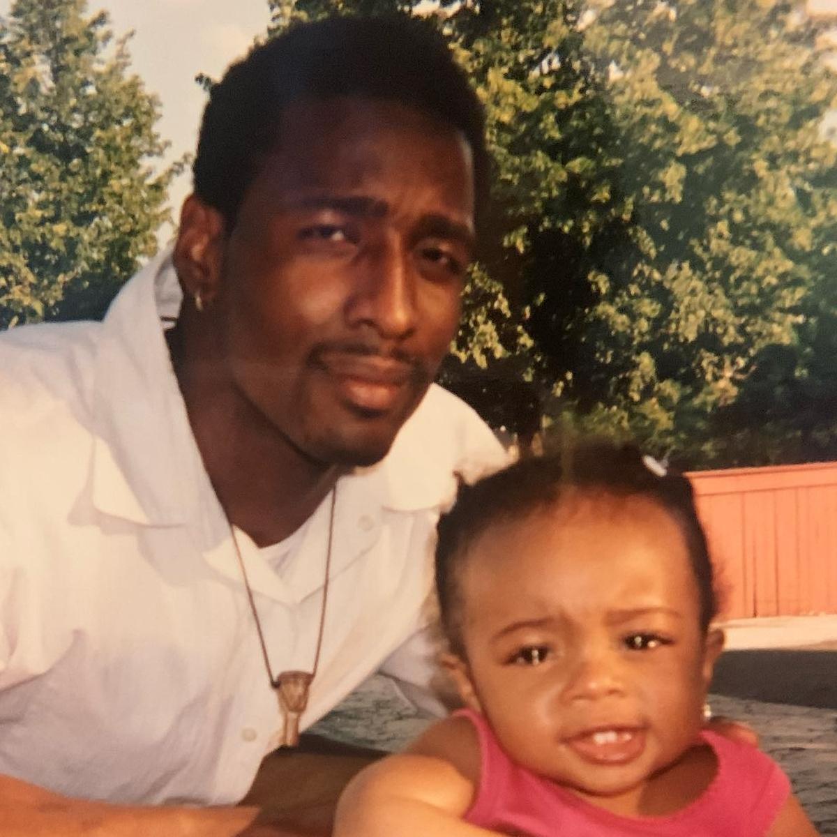 A young Skai Jackson and her father 