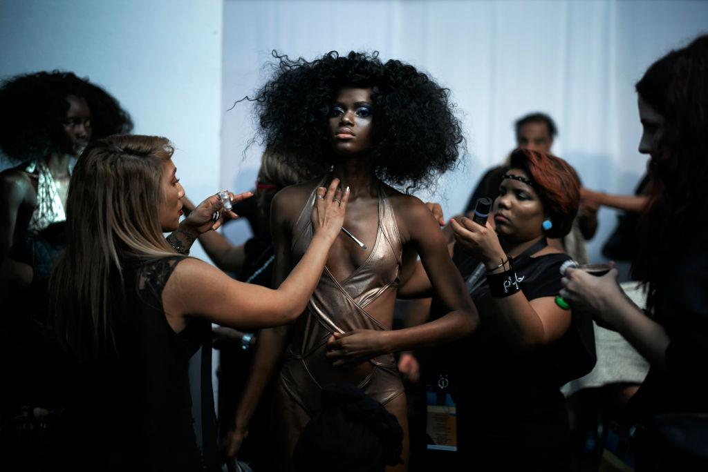 Nigerian model Imade Ogbewi gets make-up before for a show