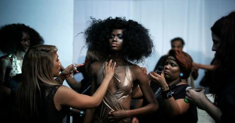 Nigerian model Imade Ogbewi gets make-up before for a show