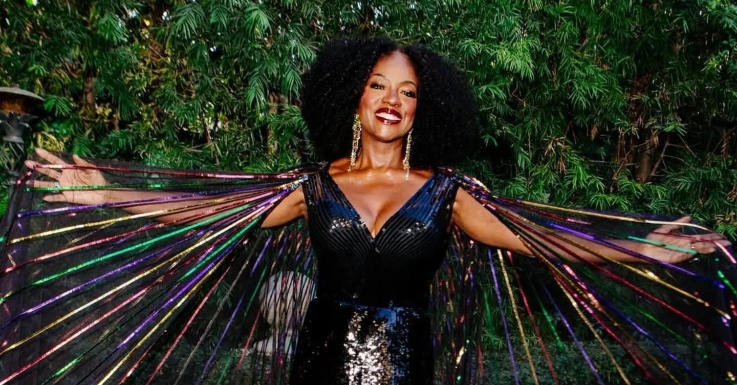 Viola Davis wears a colorful dress.