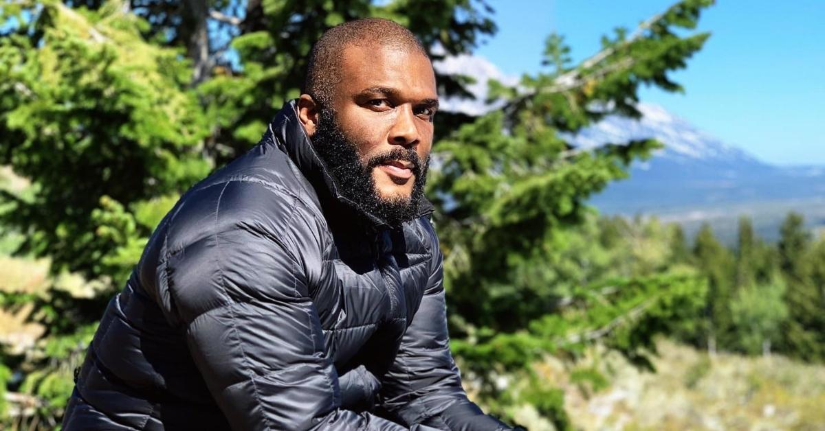 Tyler Perry sitting in nature.