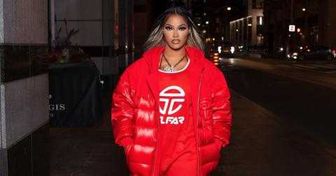 Joseline Hernandez wears Telfar jersey and puffer jacket.