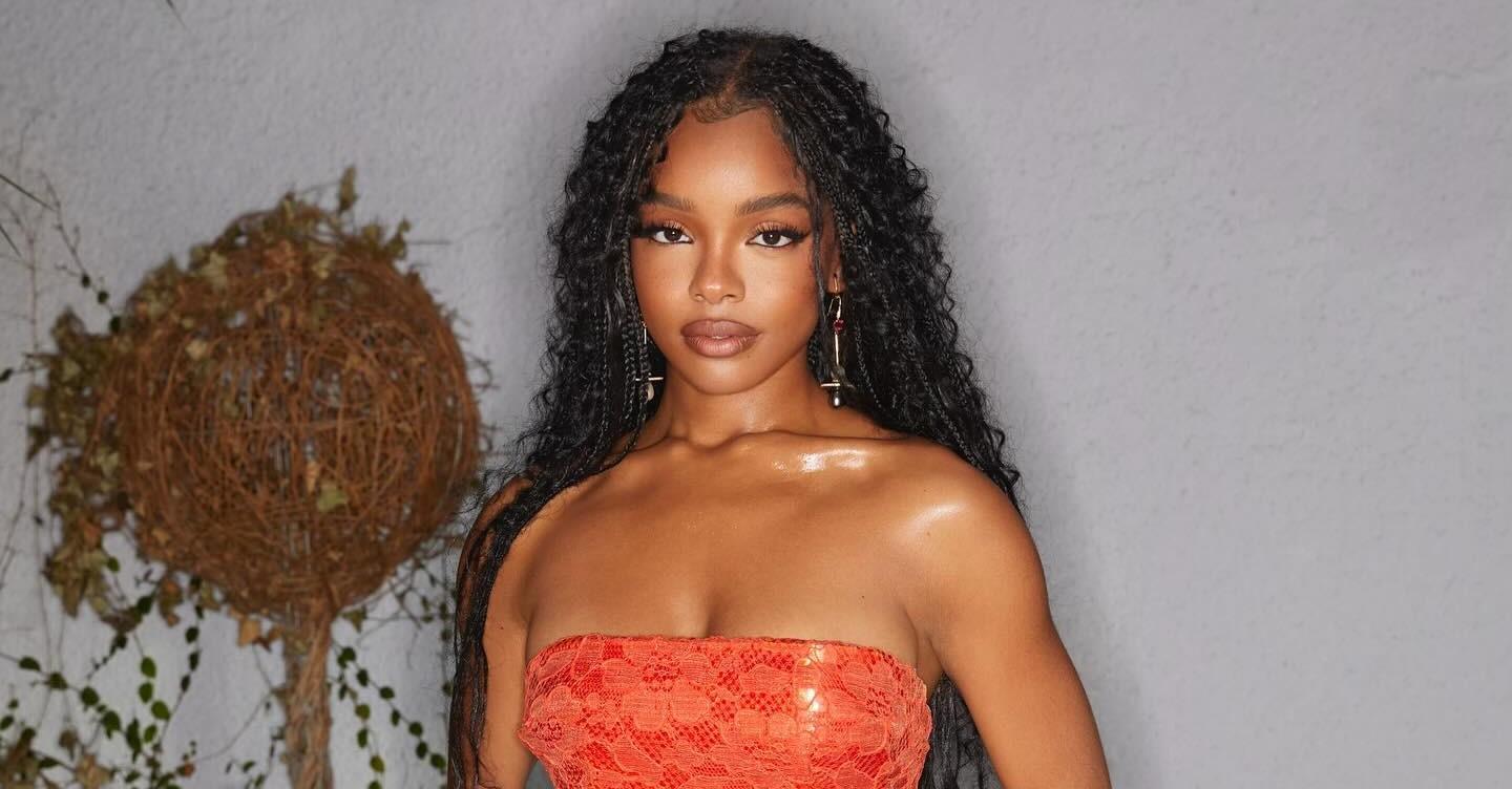 Marsai Martin wears boho braids and an orange dress.